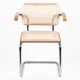 Replica of the Cesca Chair with armrests by designer Marcel Breuer